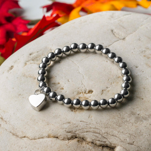 Bracciale di perline con urna a cuore